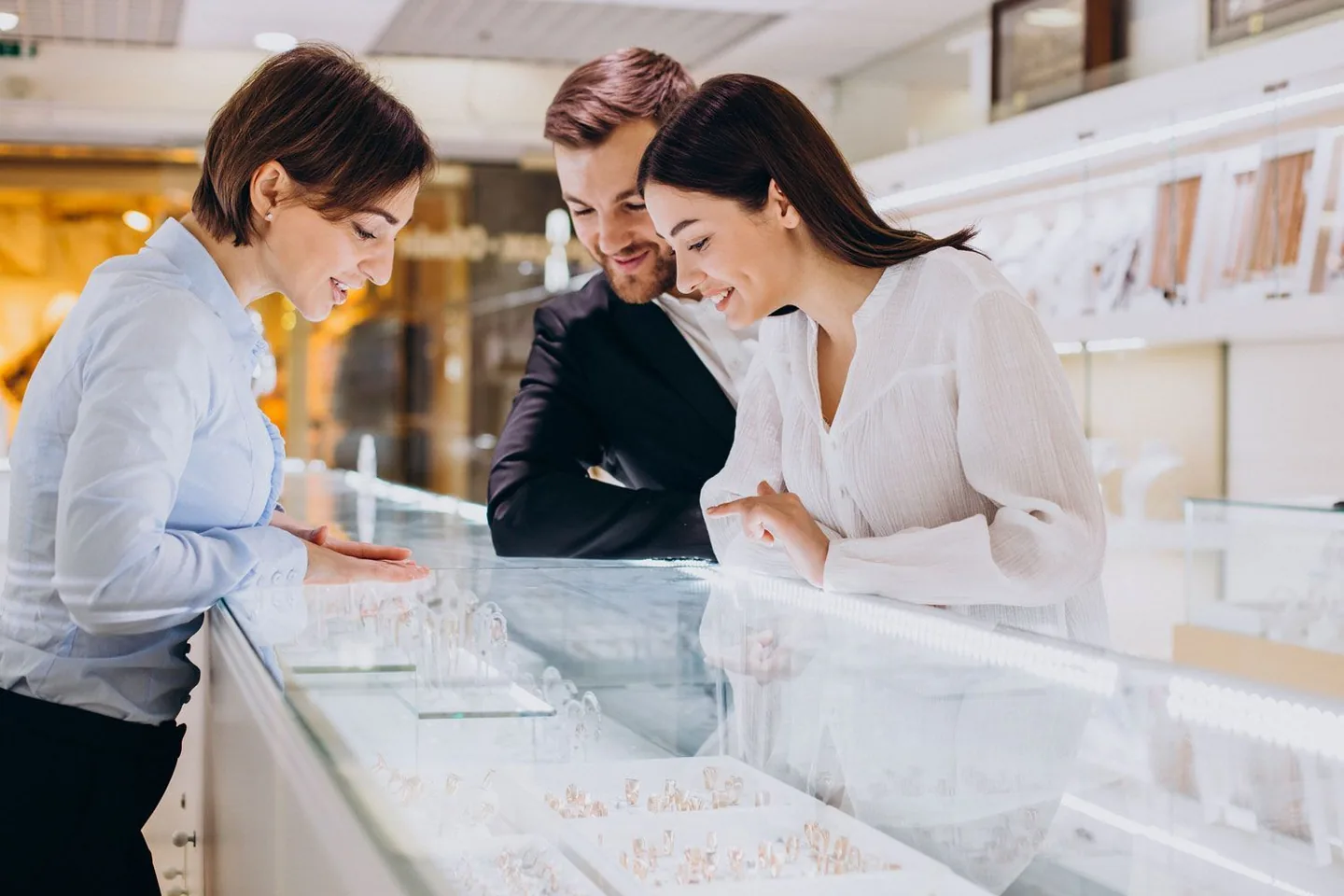 Jeweller serving a customer at the counter with the PrismaNote EPOS system — a modern Bransom Bsmart alternative for jewellery shops